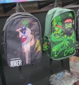 Premium smoke shop accessories including bags, towels, posters, shirts, and unique smoking gear available at One Stop Smoke Shop, the best vape shop in Houston.